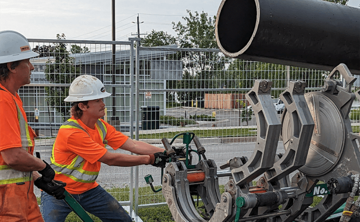 <p>City of Quinte West employees move a water pipe into position during repair operations last week. (City of Quinte West photo)</p>
